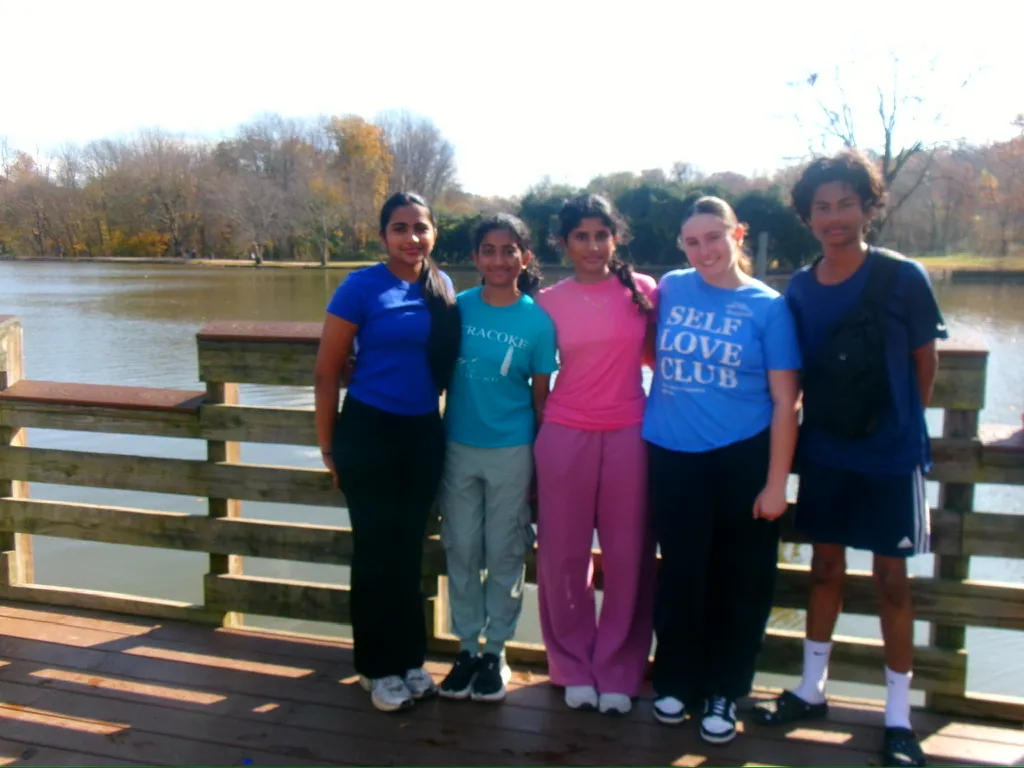 Volunteers on a lakeside boardwalk