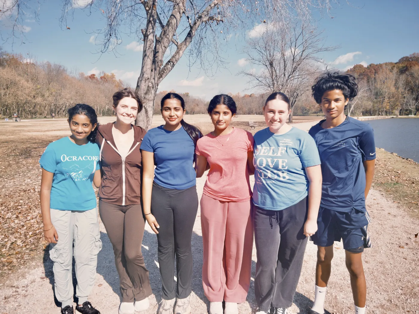 SUN volunteers posing together on a trail at the walk