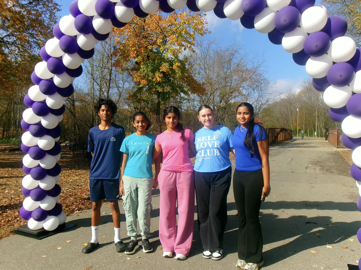 SUN members under a purple balloon arch at the Walk to END Epilepsy