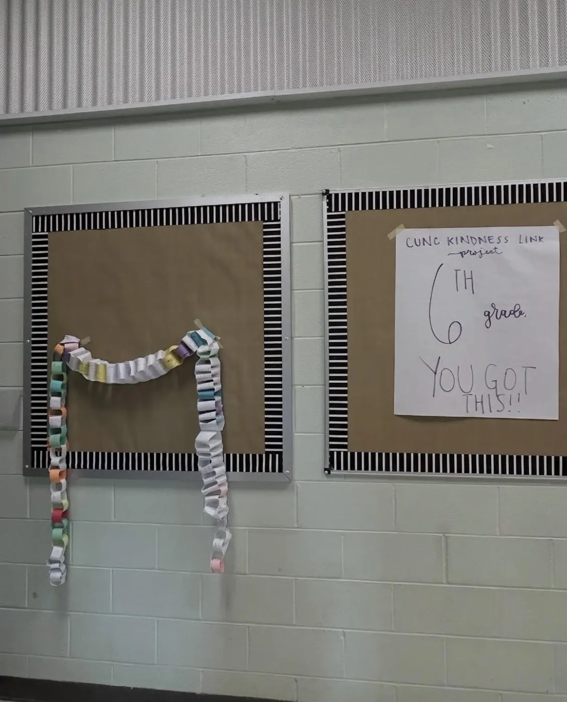 Kindness chains hanging on a school bulletin board