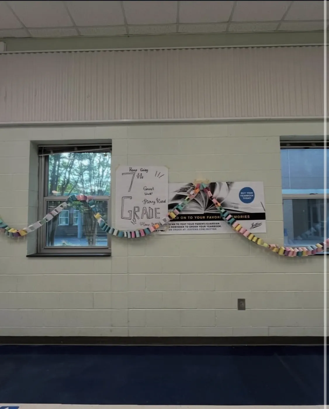 A long kindness chain strung along a school hallway wall